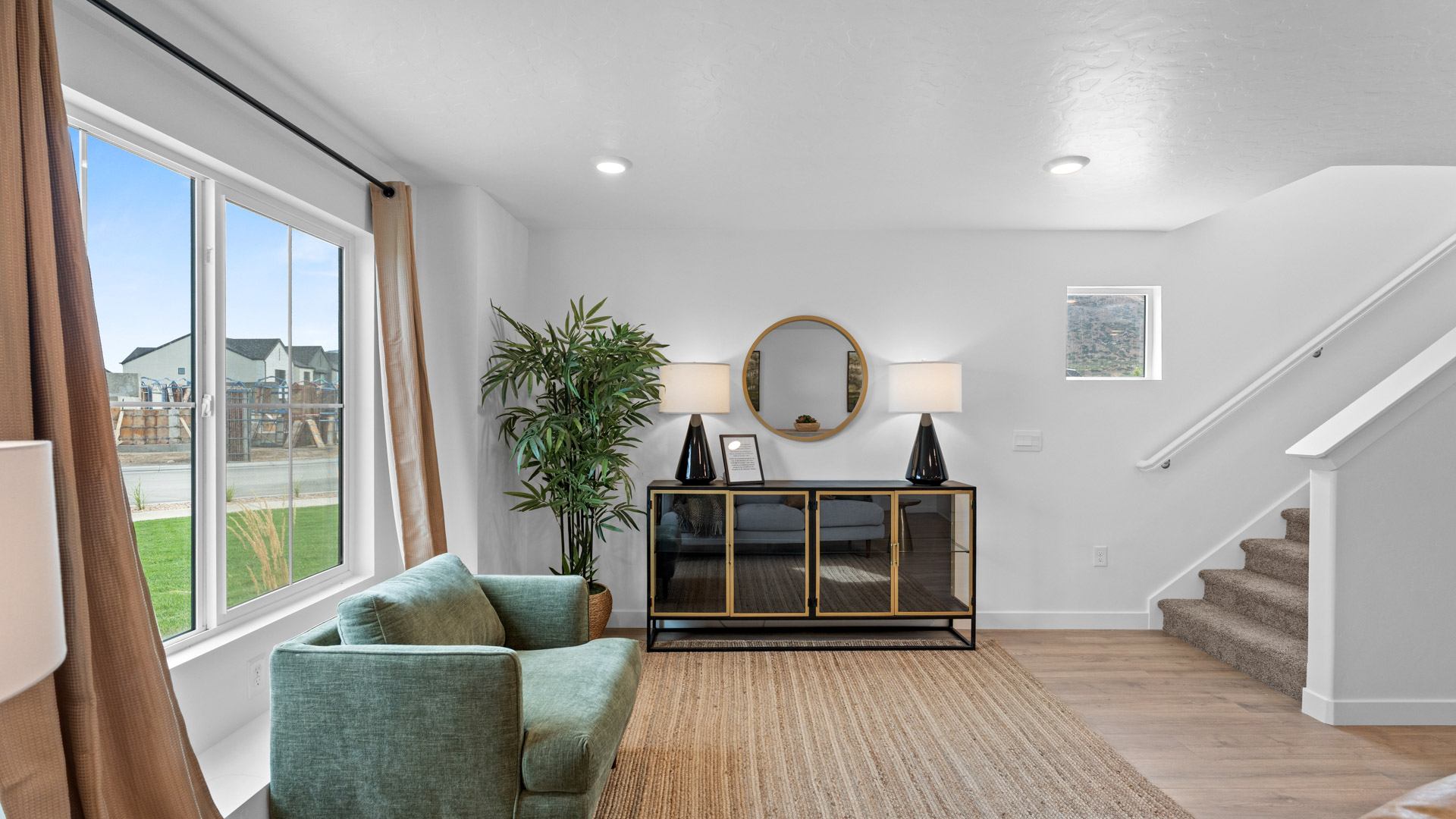 Living room off the entry with large window.