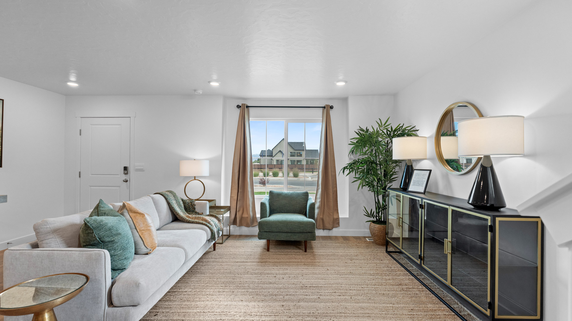 Living room off the entry with large window.