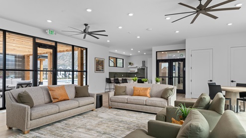 Main clubhouse space with living room and kitchen for hosting.