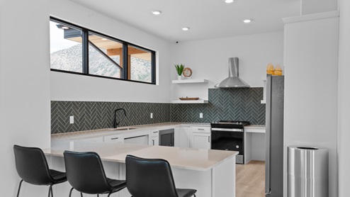 Main clubhouse space with living room and kitchen for hosting.