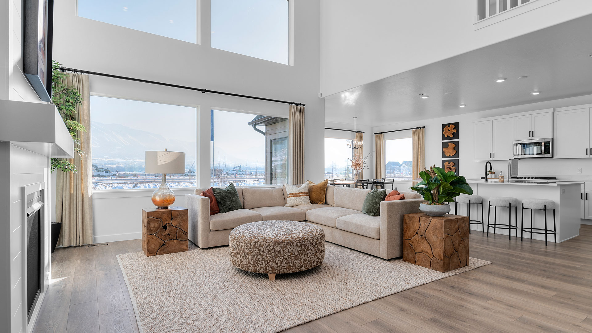 Family room with two story vaulted ceiling with floor to ceiling picture windows