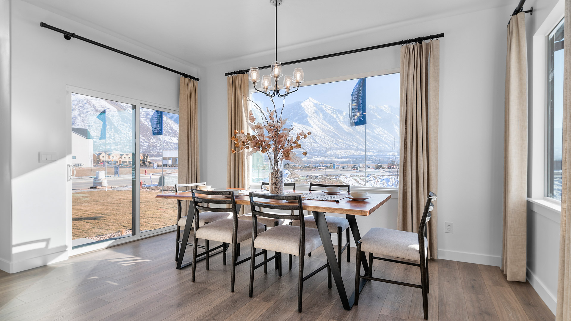 Dining room with patio doors and large windows.
