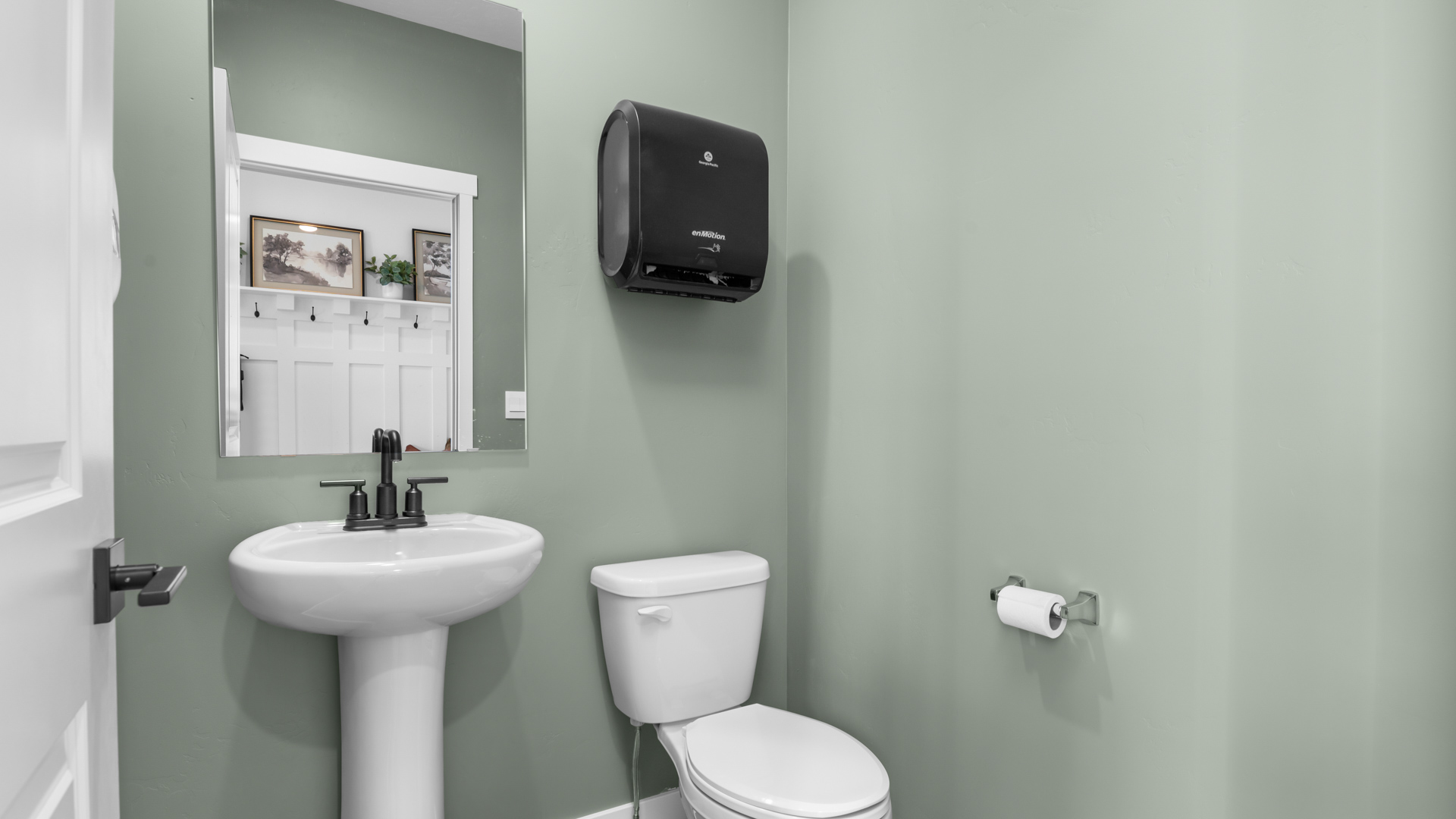 Power bathroom on the main floor with pedestal sink.