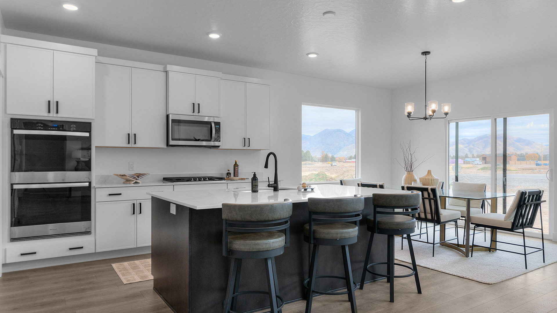 Kitchen space with dark cabinets and kitchen island.