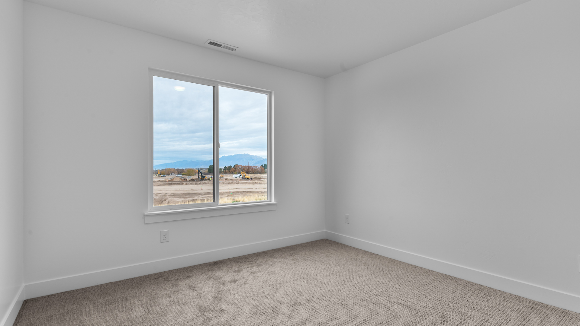 Bedroom with large window.