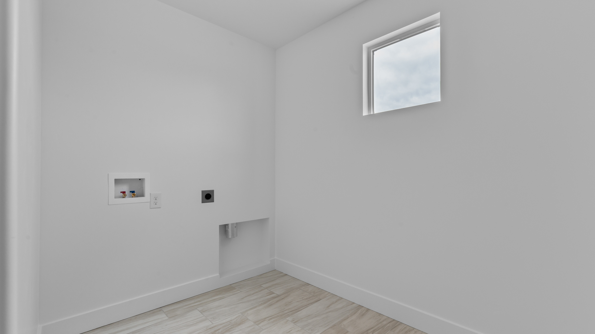 Laundry room with shelving.