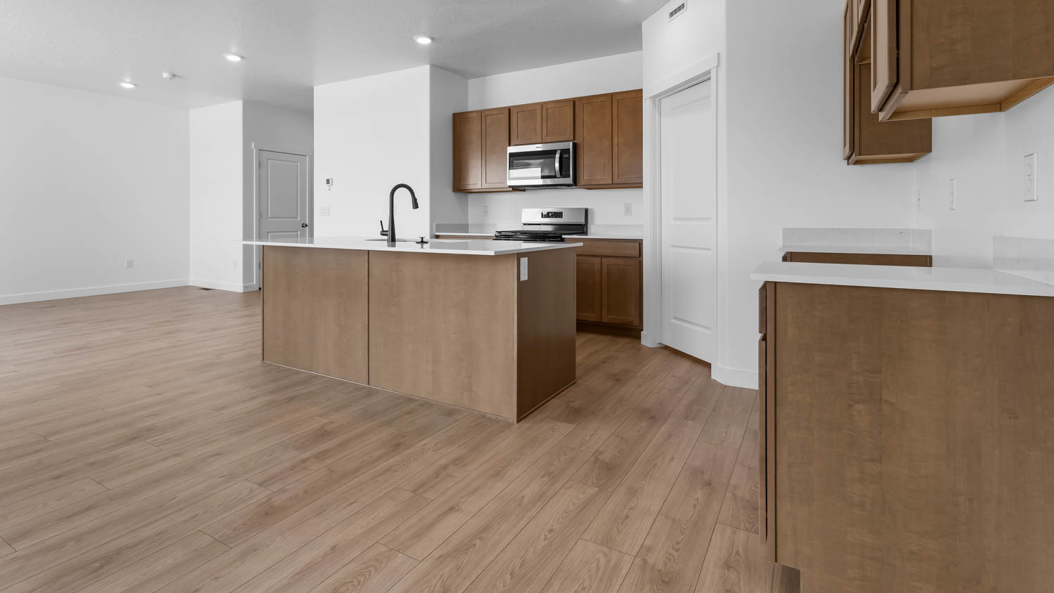 Kitchen with kitchen island and cabinets.