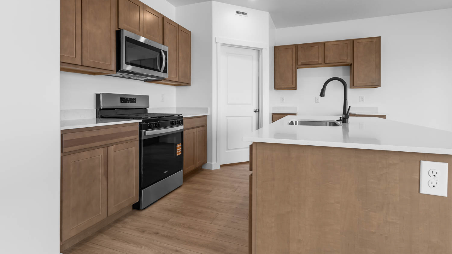 Kitchen with kitchen island and cabinets.