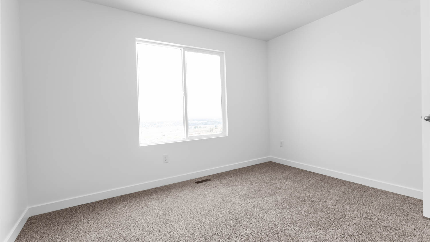 Bedroom with large window.