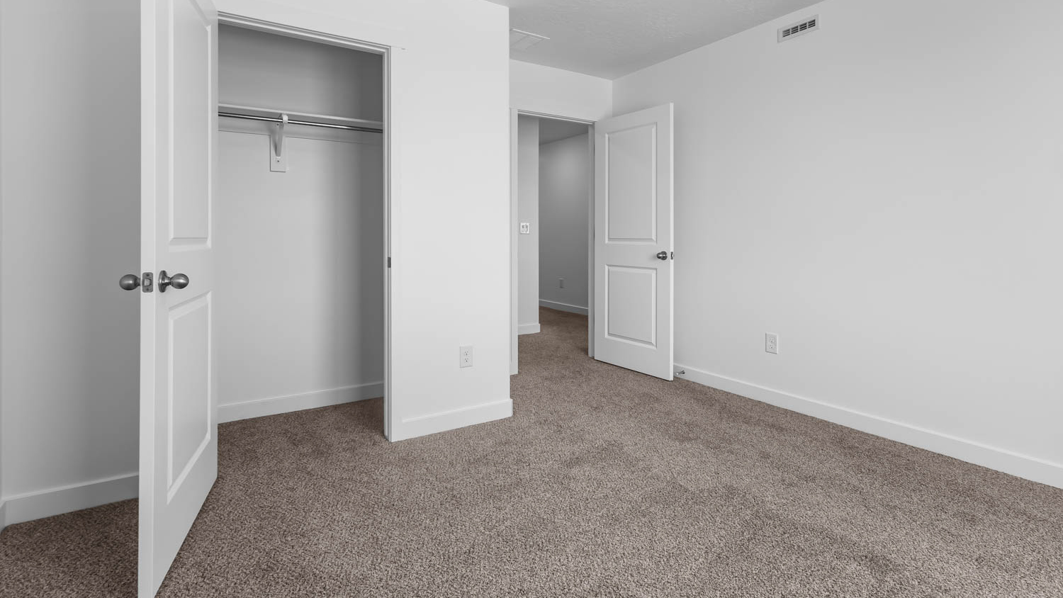 Bedroom with large window.