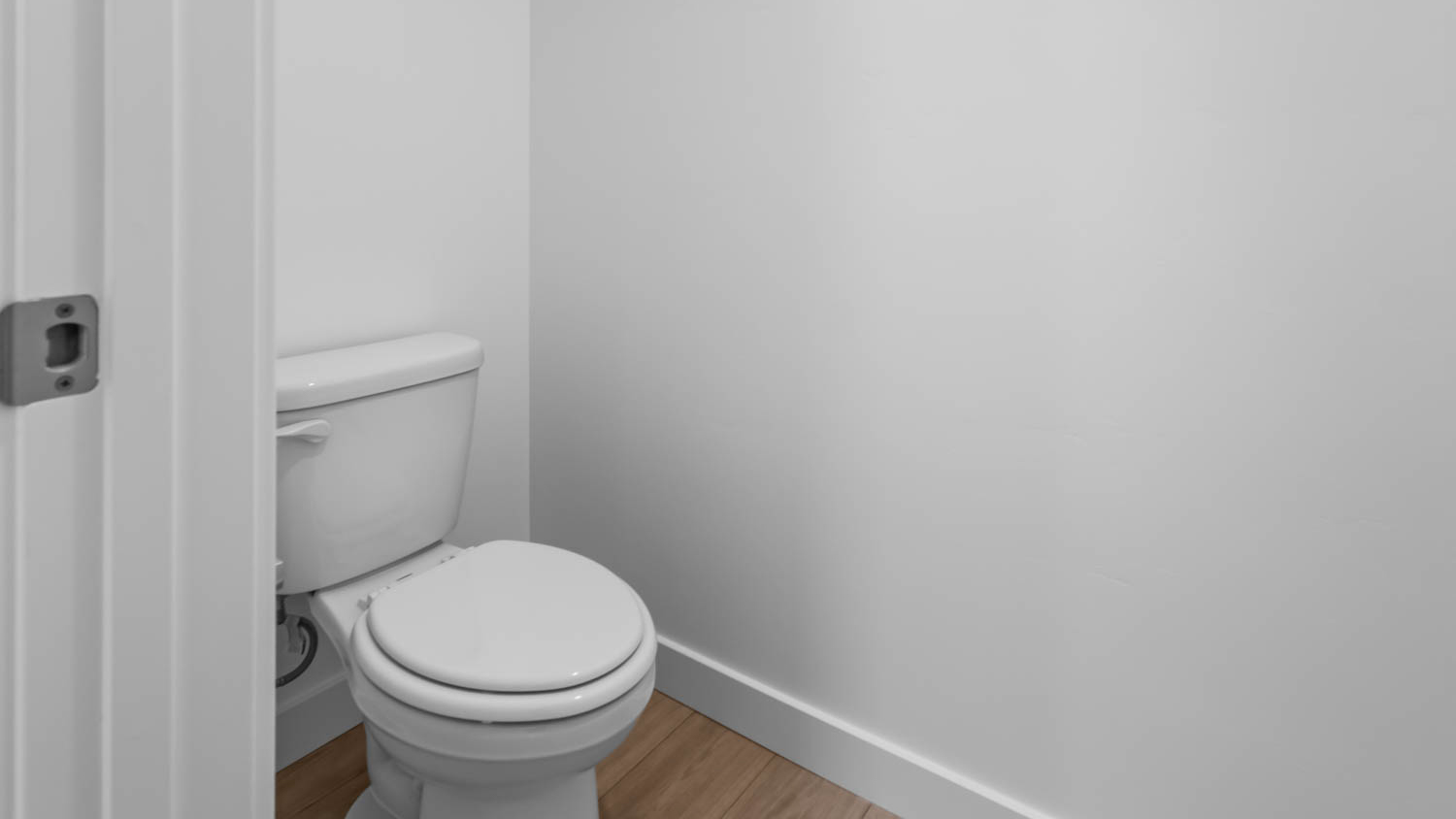 Primary bathroom with vanity and shower surround and window.