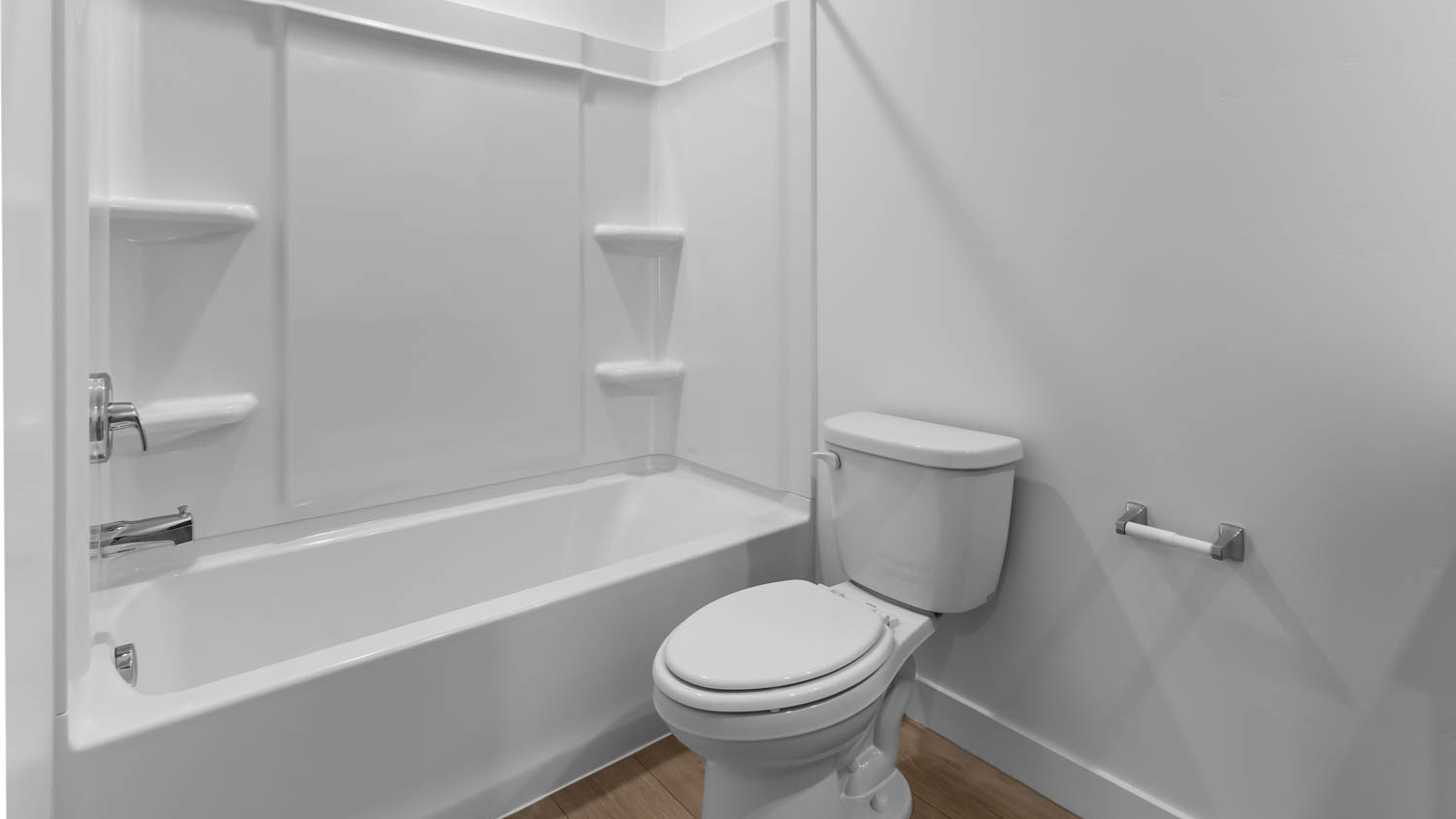 Bathroom with vanity and shower surround.