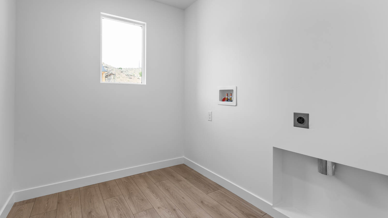 Laundry room with window.