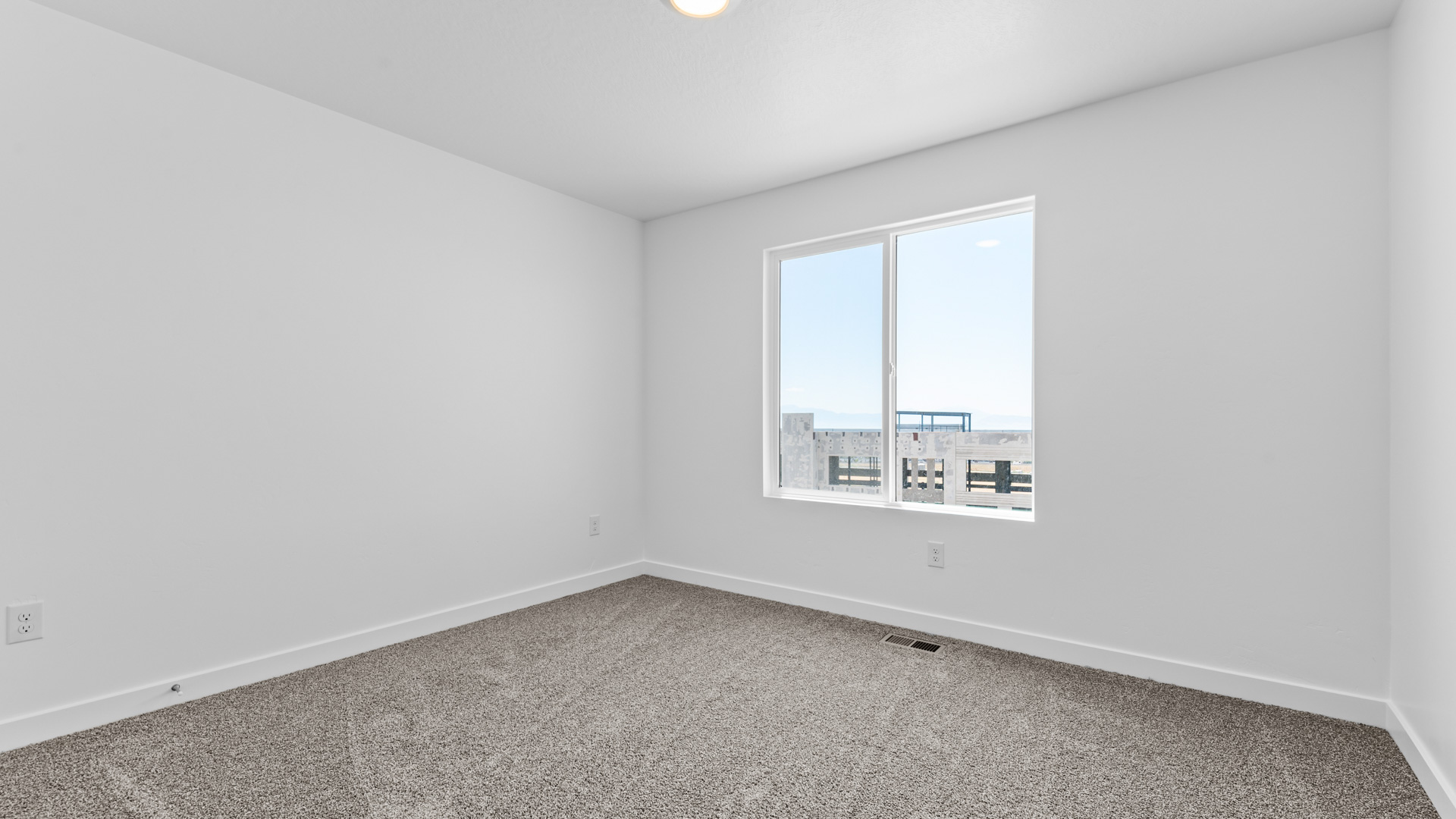 Bedroom with large window.