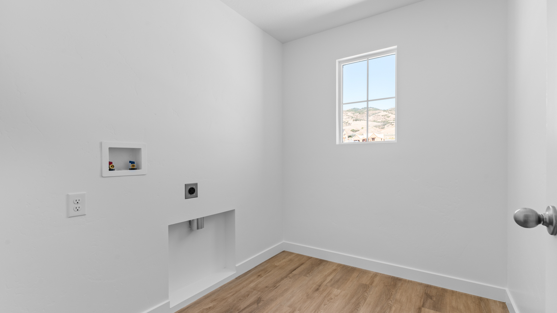 Laundry room with window.