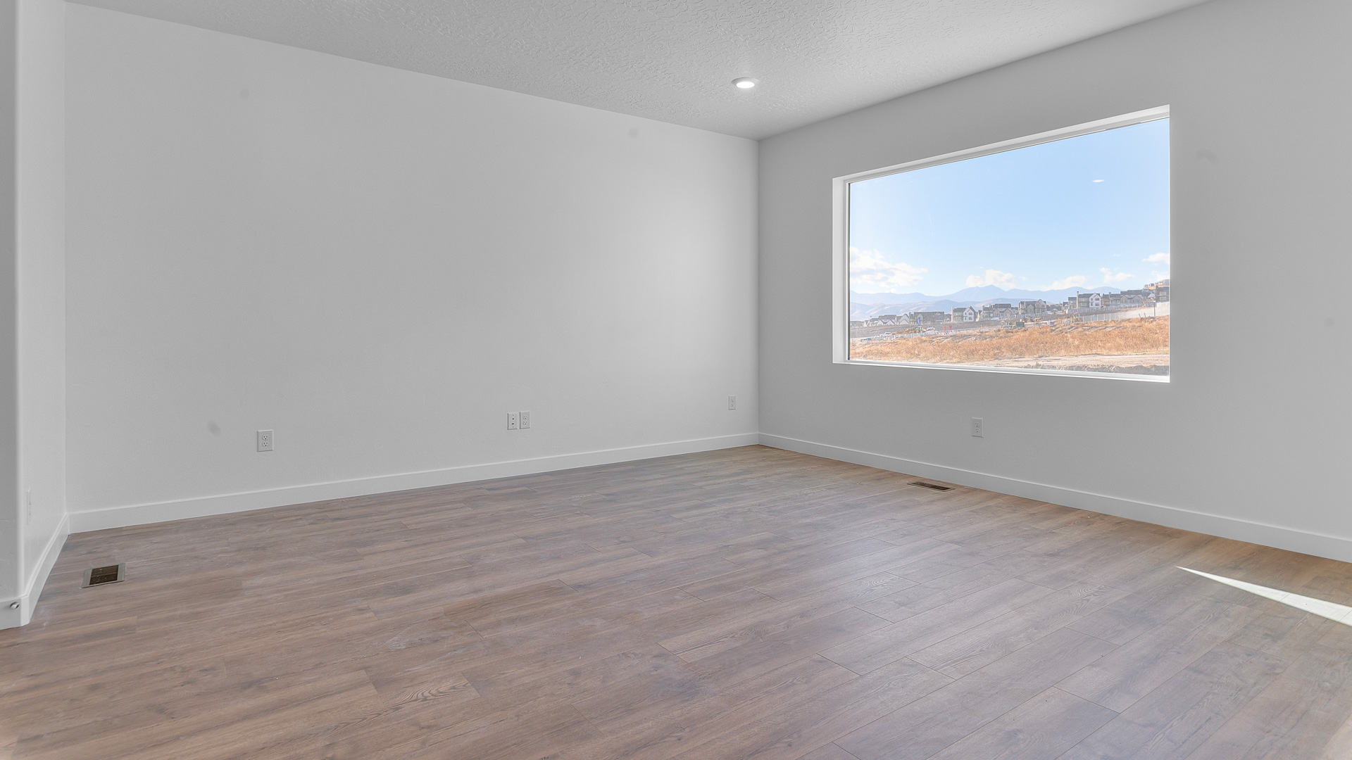 Family room with large window.