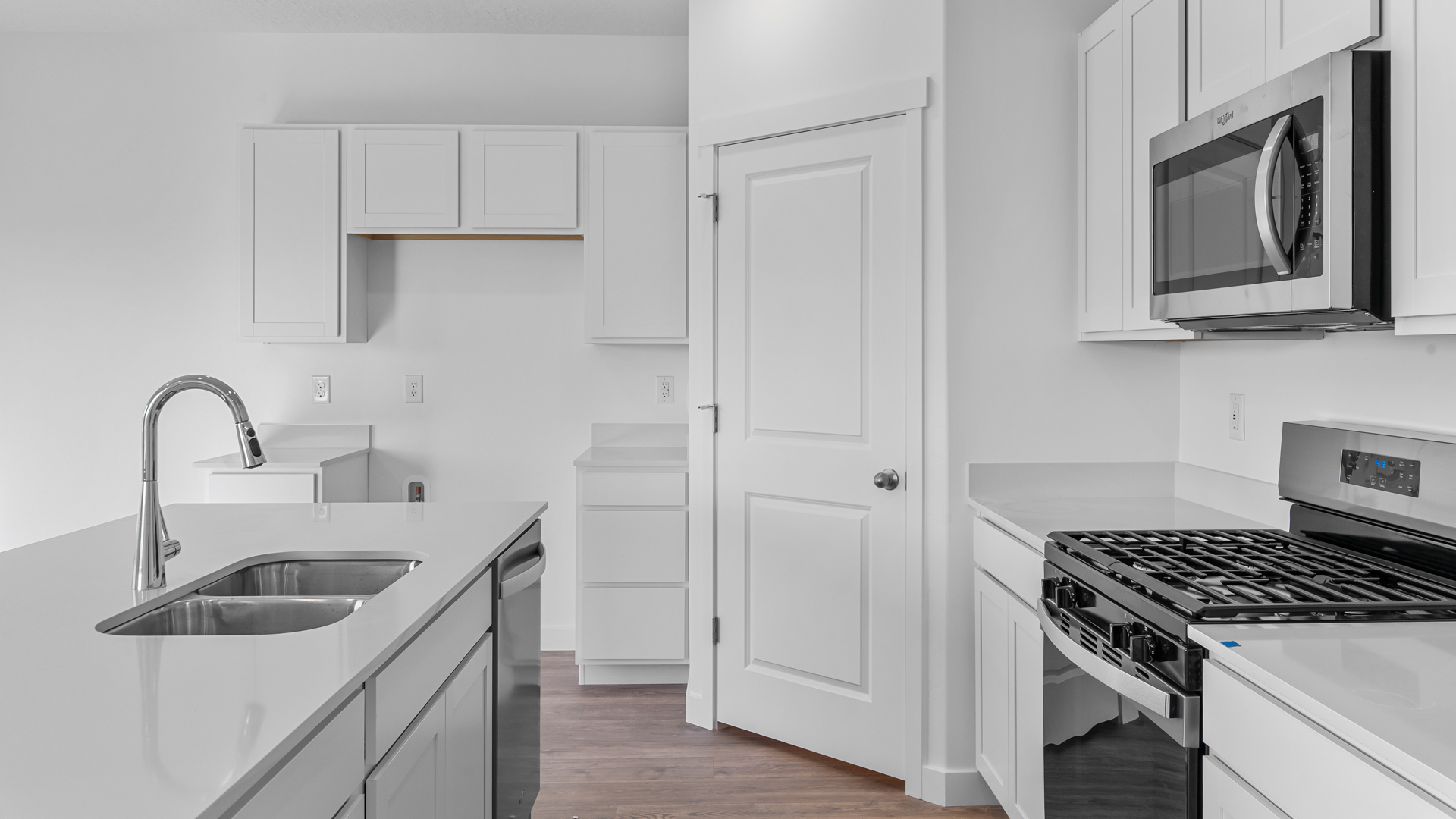 Kitchen with kitchen island and two tone cabinets.