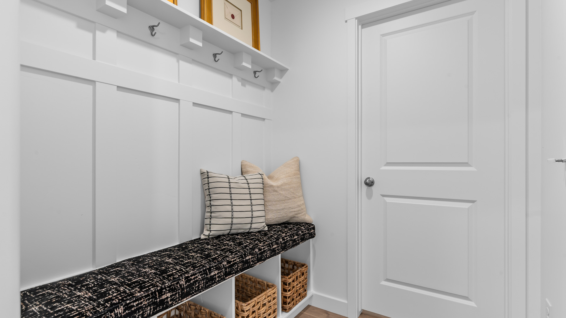 Mudroom with mudroom bench and storage.