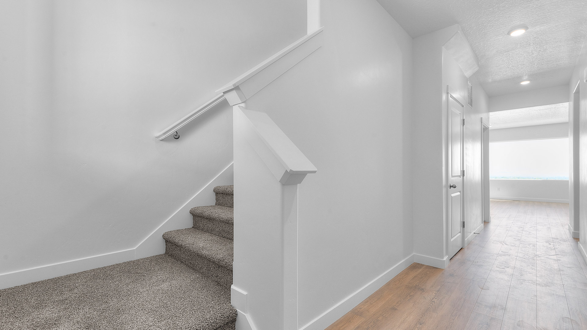 Spacious entry into main living space and access to upstairs.