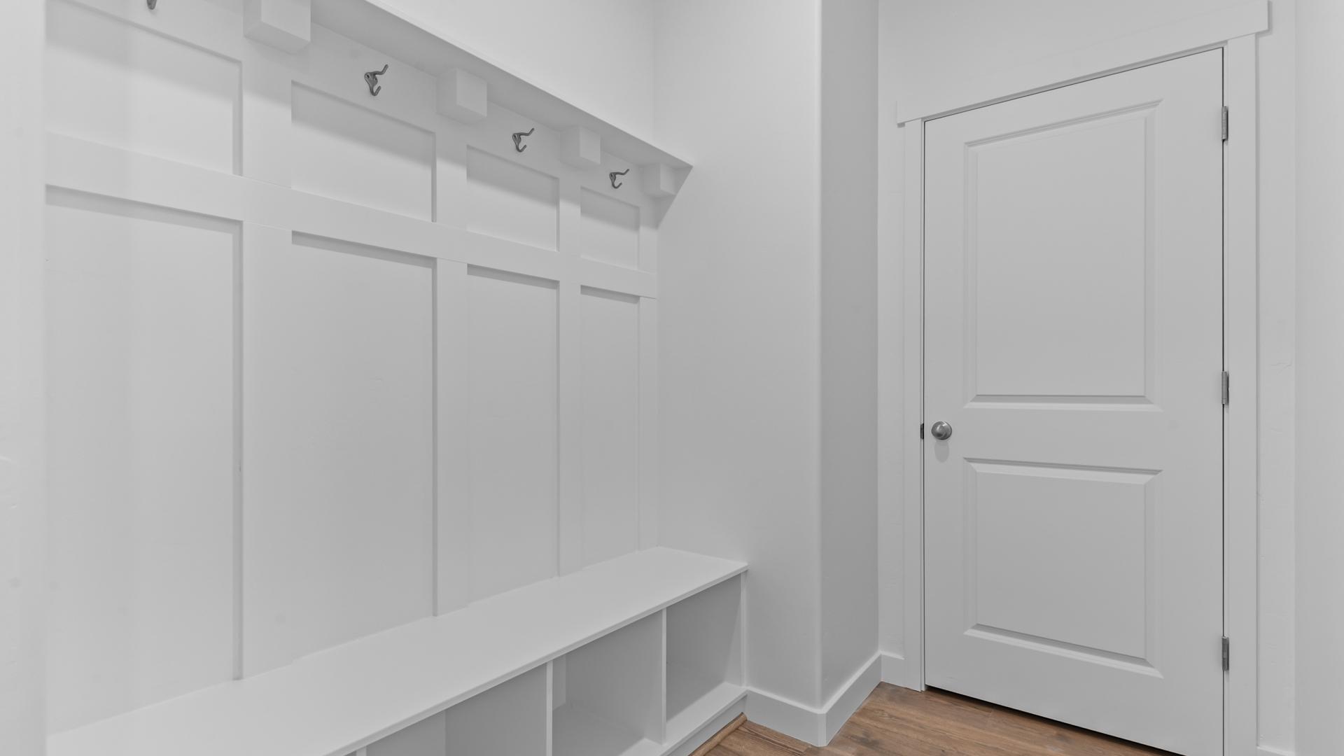 Mudroom with mudroom storage bench and hooks.