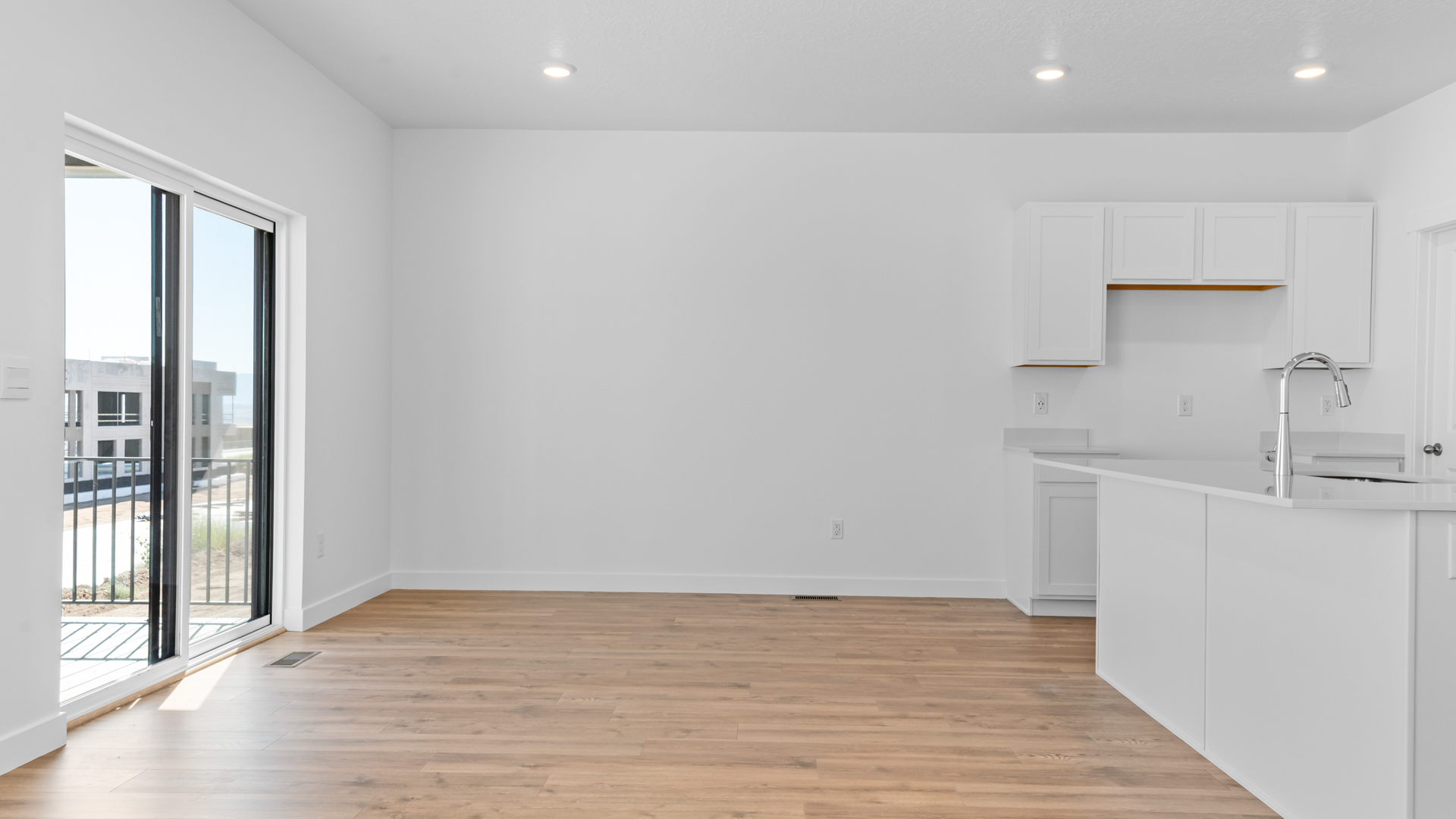 Dining room with glass patio doors.