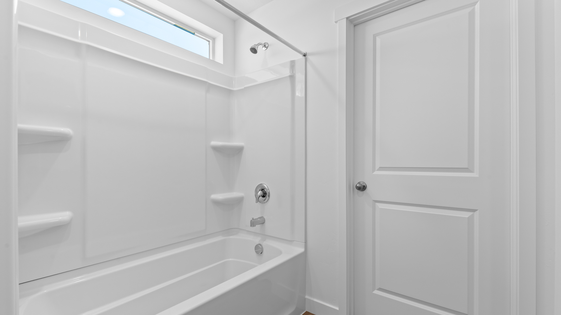 Shower surround with window above.