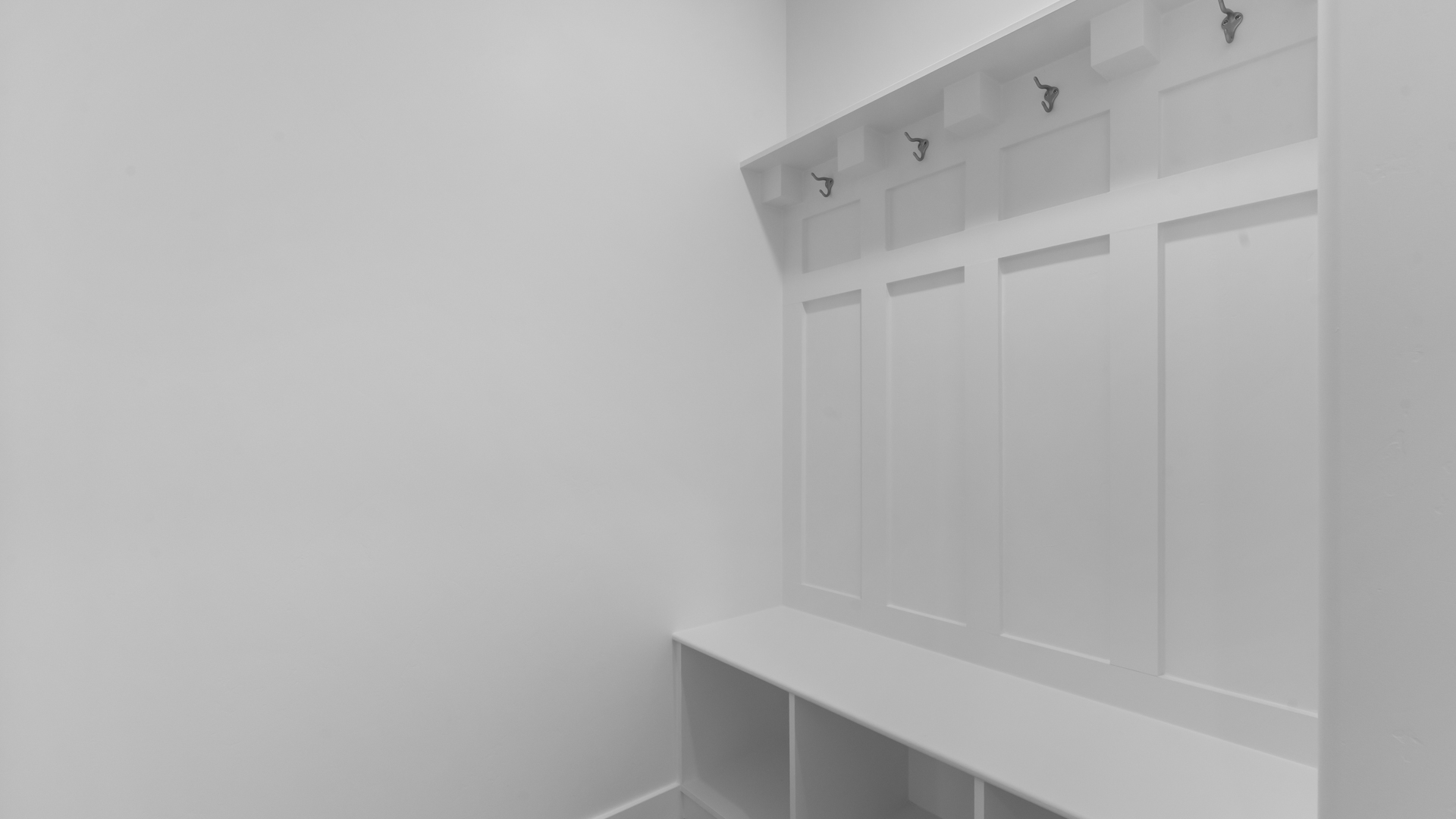 Mudroom bench off garage door.