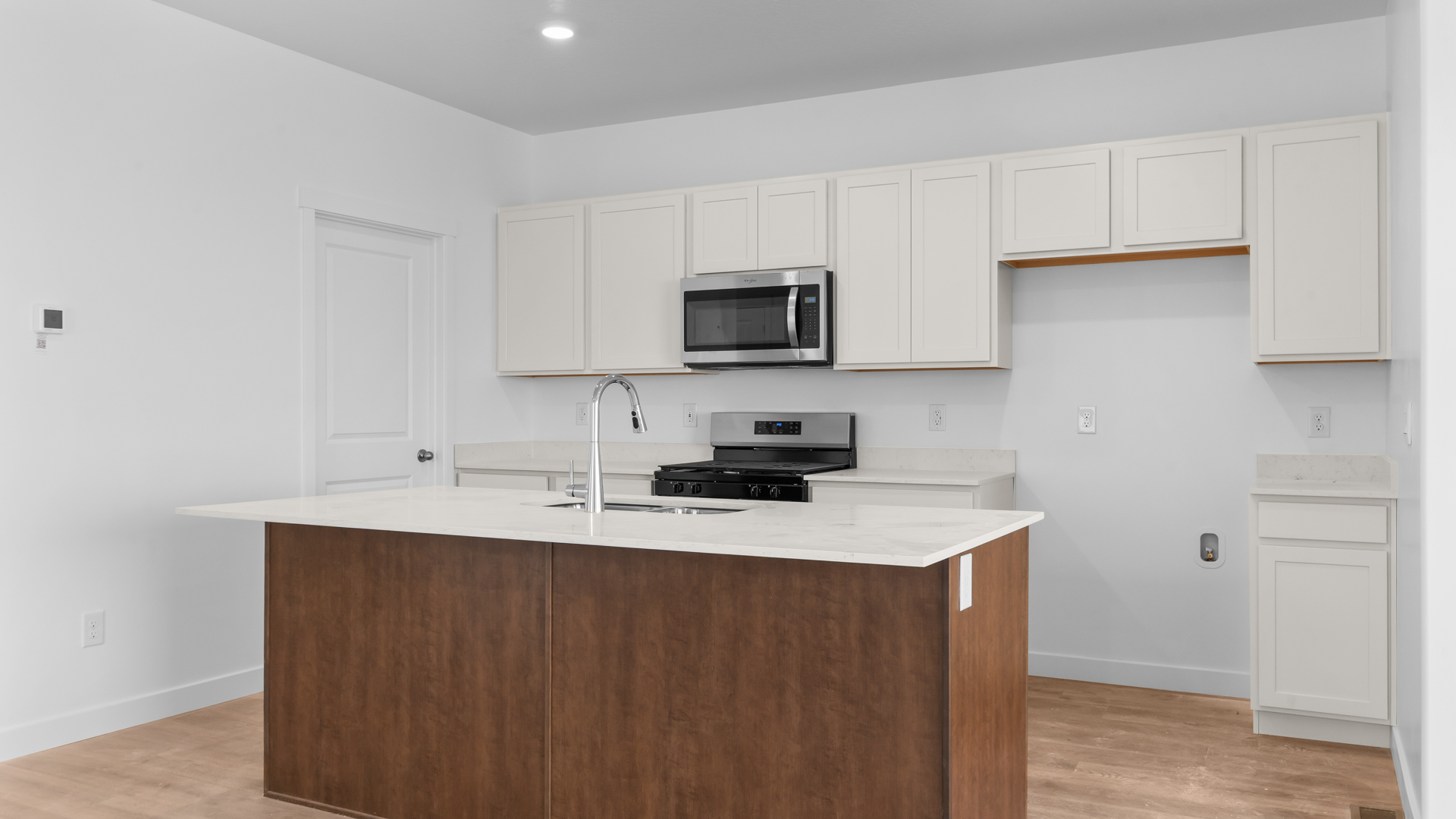 Kitchen with kitchen island.