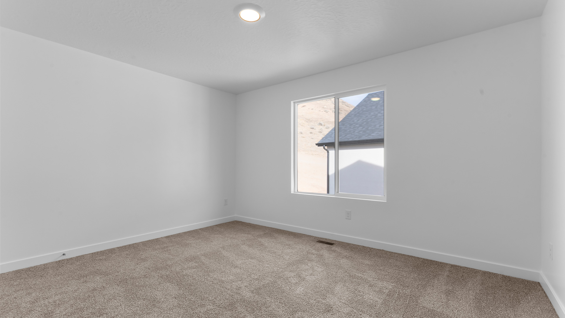 Bedroom with large window.
