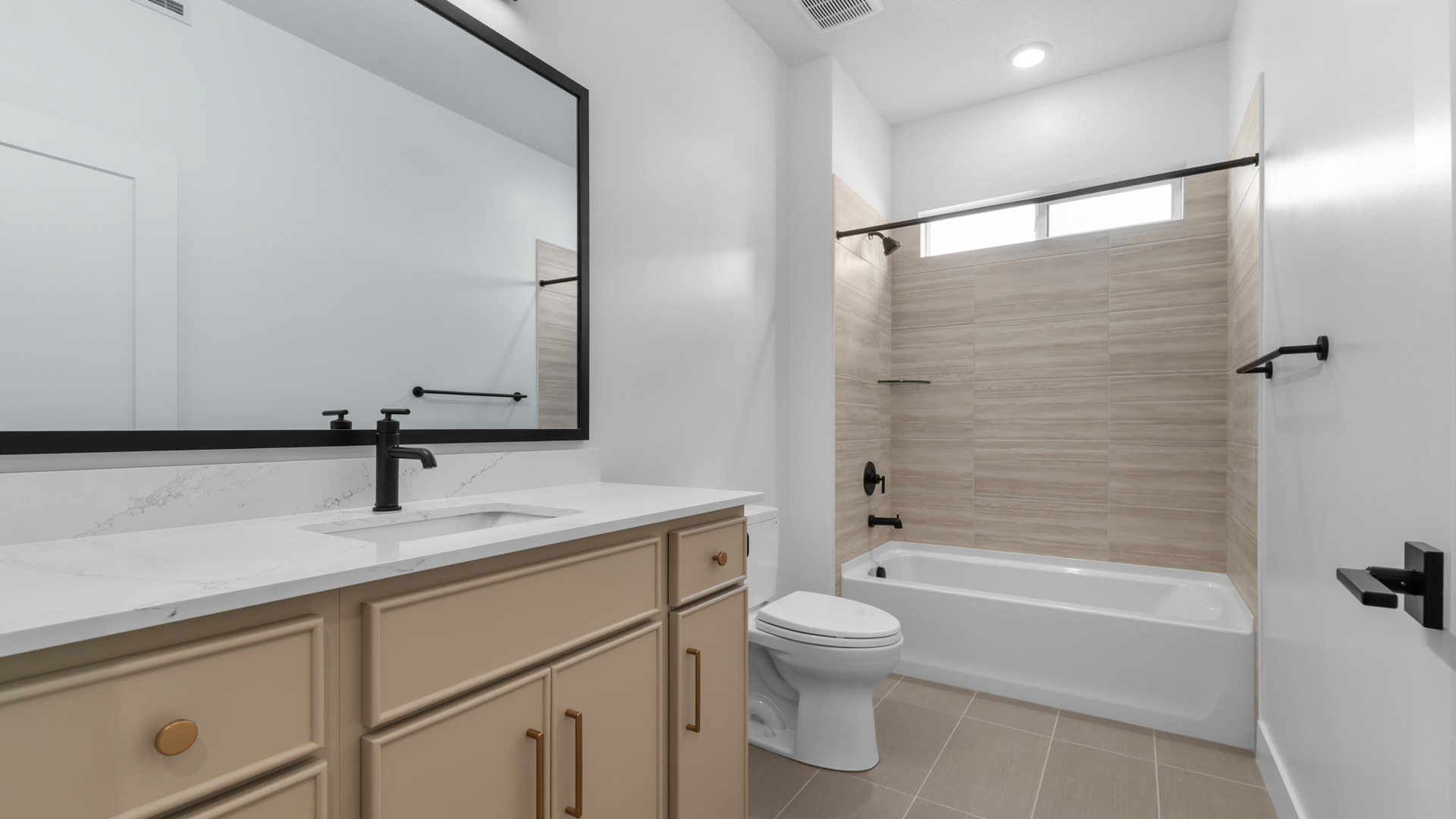 Bathroom with window above shower surround.