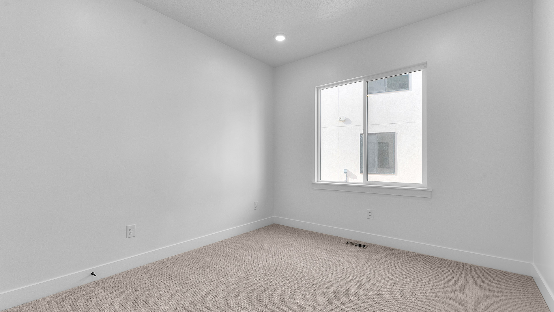 Bedroom with large window.