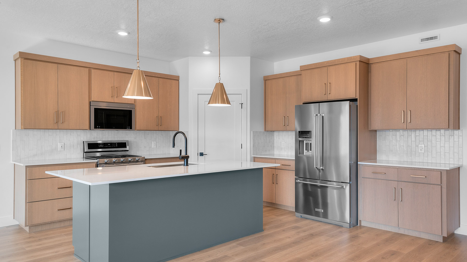 Kitchen with kitchen island and pendant lighting.