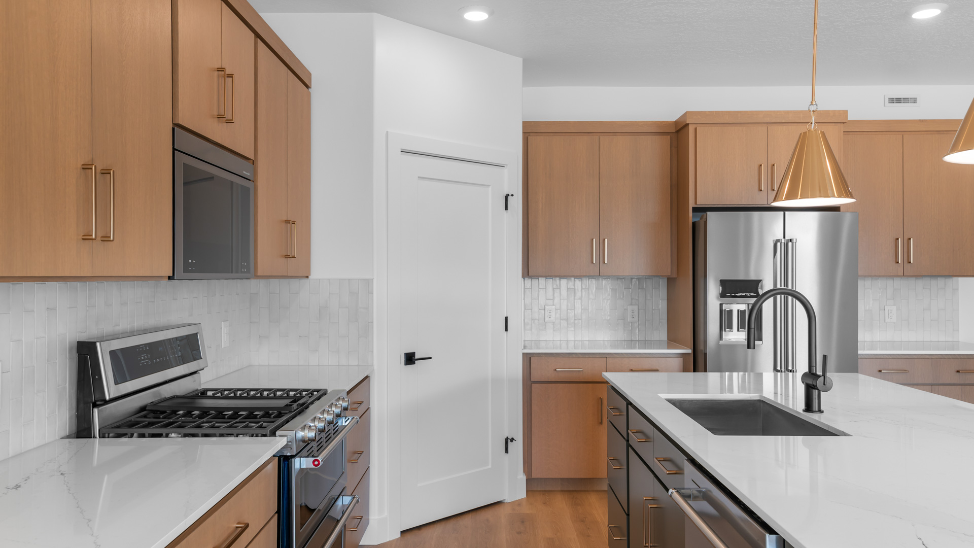 Kitchen with white cabinets and countertops.