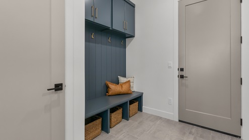 Mudroom off garage with storage bench.