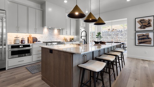 Spacious kitchen with two countertops and stainless steel appliances.