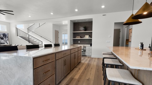 Spacious kitchen with two countertops and stainless steel appliances.