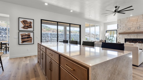 Spacious kitchen with two countertops and stainless steel appliances.
