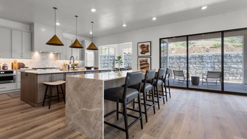 Spacious kitchen with two countertops and stainless steel appliances.