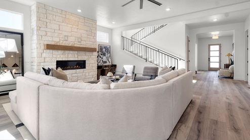 Family room with fireplace and windows.