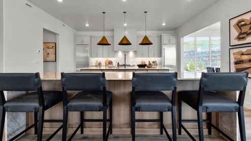 Spacious kitchen with two countertops and stainless steel appliances.
