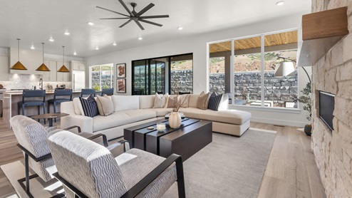 Family room with fireplace and windows.
