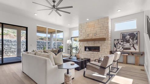Family room with fireplace and windows.