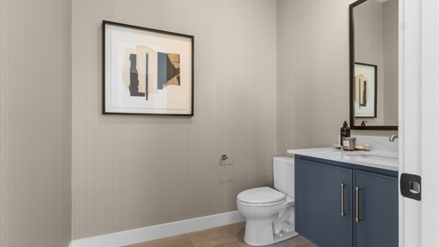 Powder bathroom near stairs.