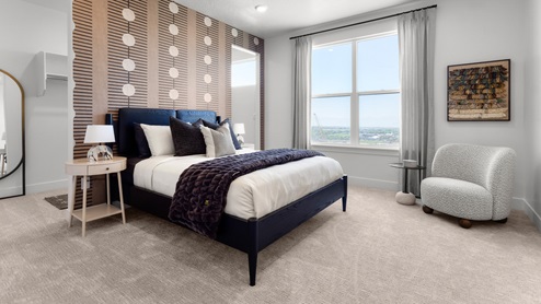 Bedroom with large window and open walk-in closet.