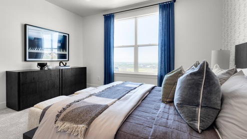 Bedroom with large window.