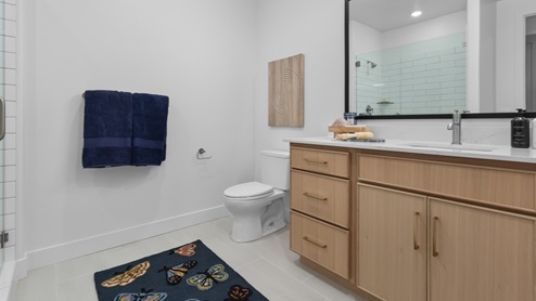 Bathroom with vanity and glass shower.