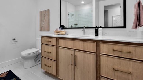 Bathroom with vanity and glass shower.