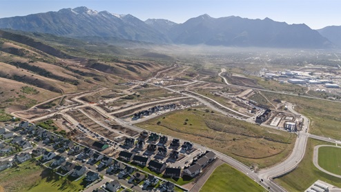 Aerial view looking towards mountains with the new homes.