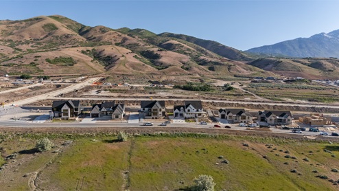 Aerial view looking towards mountains with the new homes.