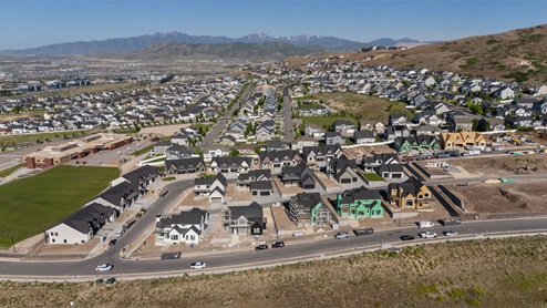 Aerial view looking towards mountains with the new homes.
